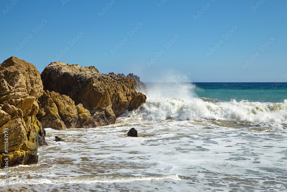 Waves beating against coastal rocks on the cliffs