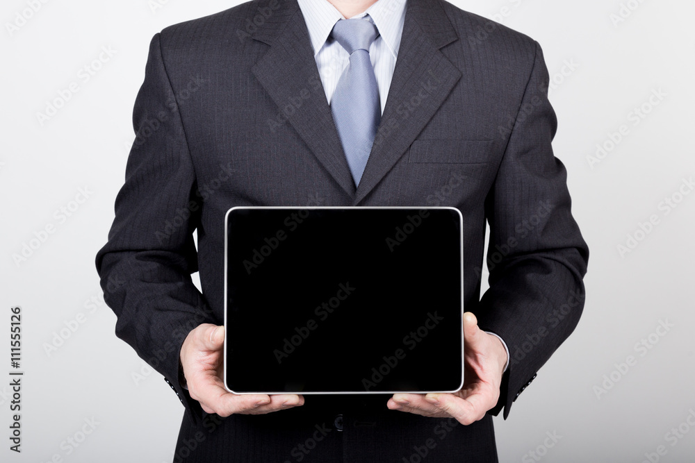 technology, internet and networking in business concept - businessman holding a tablet pc with blank dark screen. Internet technologies in business technology, internet and networking in business concept - businessman holding a tablet pc with blank dark screen. Internet technologies in business