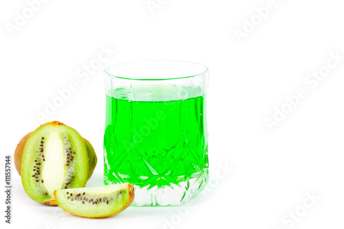 Green juice in a glass and kiwi