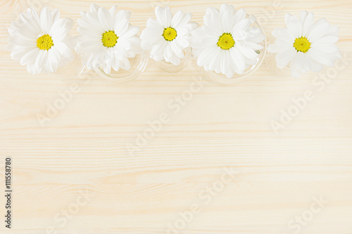 Spring white flowers on a wooden background. Copy space. Background. Pattern. Texture. © finepoints