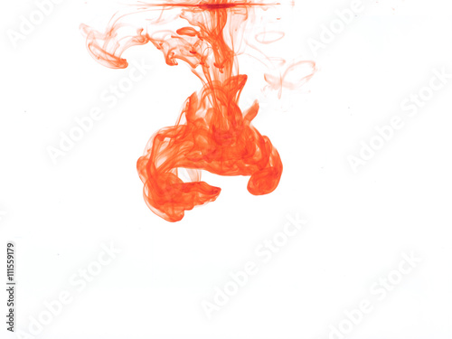 Abstract form of orange color in water, isolated on white background.
