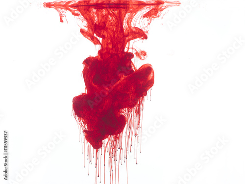 Abstract form of blood or red color in water, isolated on white background.
 photo