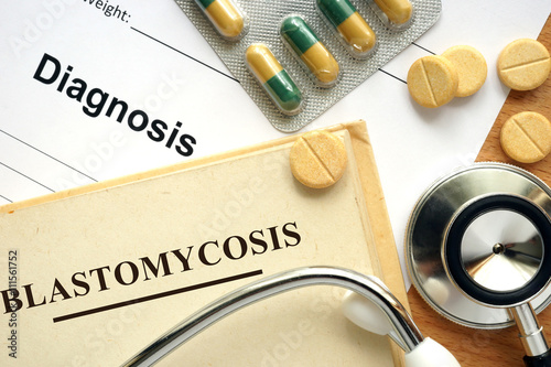 Word Blastomycosis on a book and pills. photo