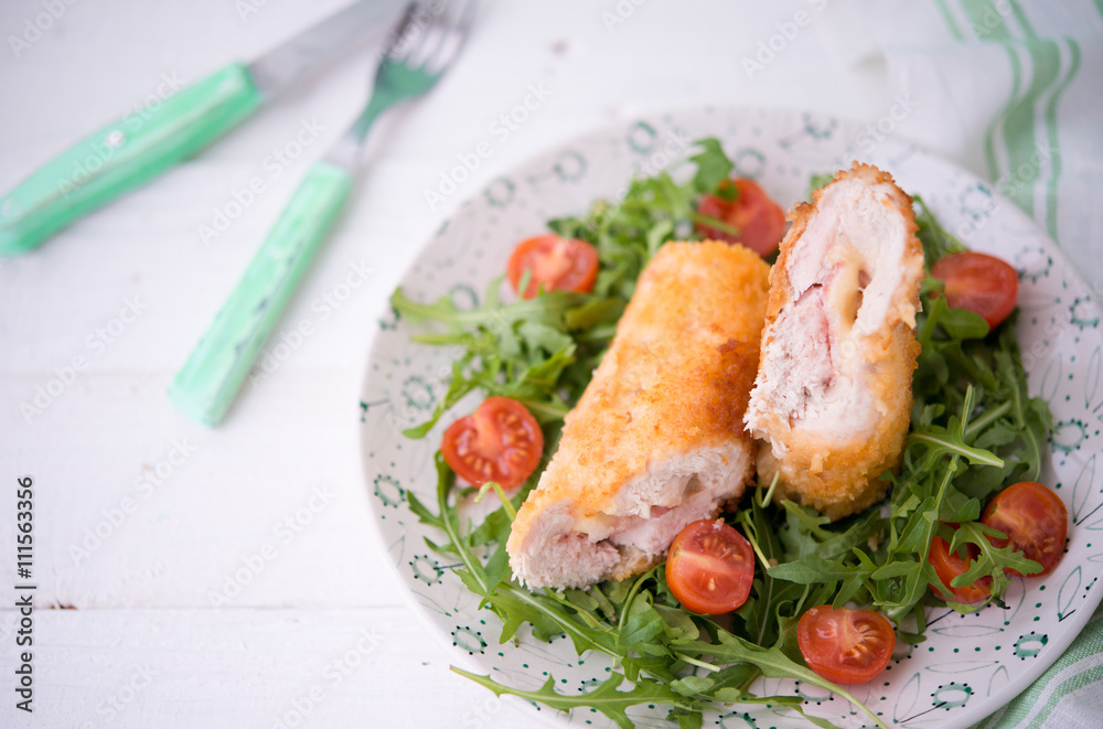 Chicken roll with cheese and fresh vegetables for dinner
Chicken roll with cheese and fresh vegetables for dinner