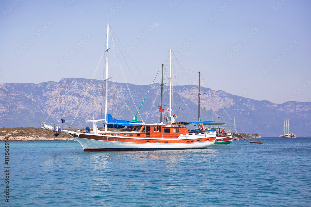 Sailing yachts anchored in calm bay. Aegean Sea, Turkey