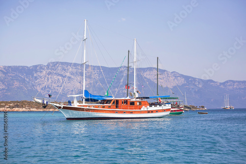 Sailing yachts anchored in calm bay. Aegean Sea, Turkey © Oleksii Nykonchuk