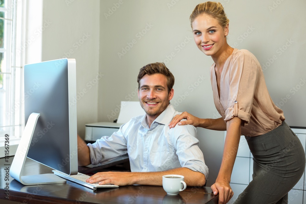 Obraz premium Portrait of happy colleagues working at office