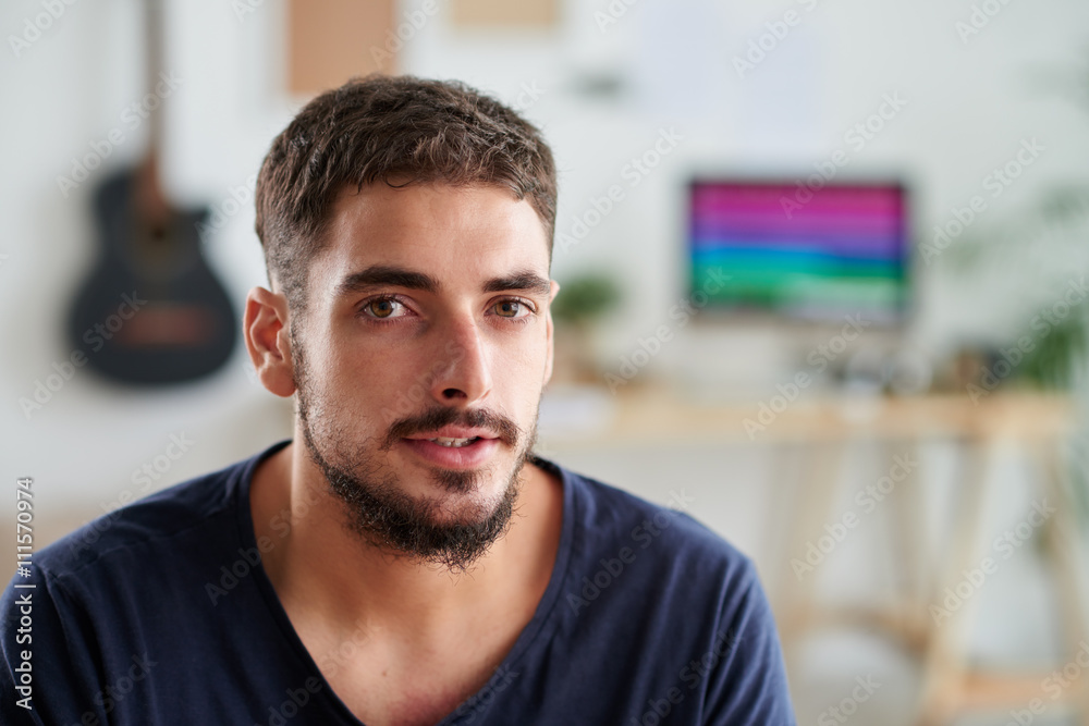 Portrait of attractive young musician looking at camera Portrait of attractive young musician looking at camera