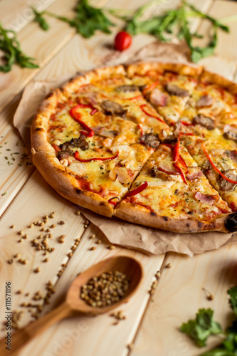 Pizza with meat and ingredients for cooking