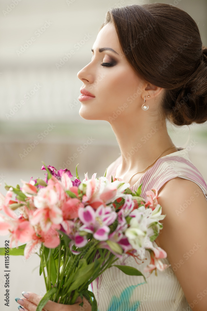 Beautiful woman with flowers outdoor