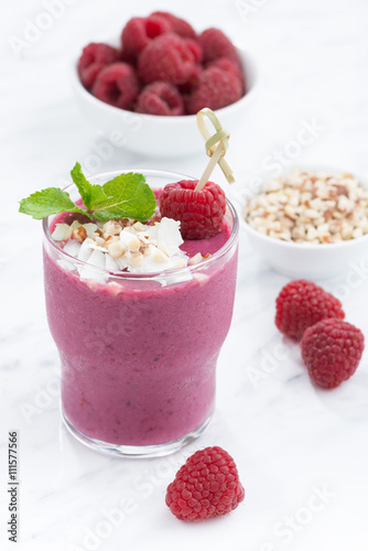 fresh berry smoothies with nuts, vertical