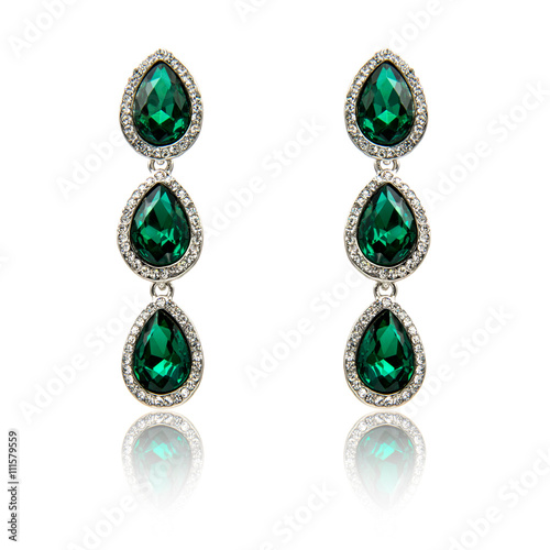 Pair of emerald earrings isolated on white
