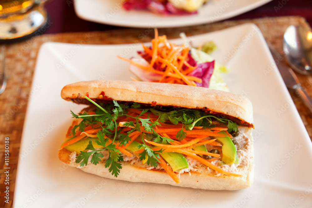 Healthy sandwich with tuna, avocado, carrots and mayonnaise