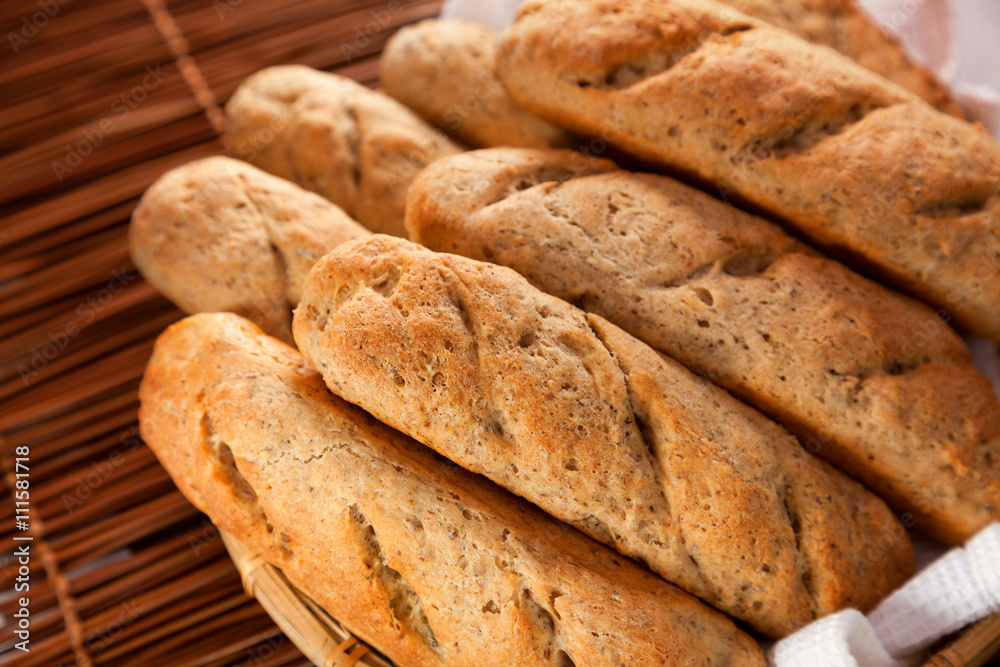 Homemade baguettes with raw wheat. Close up