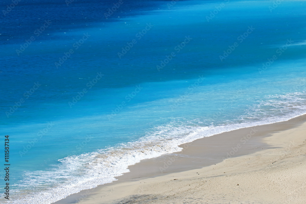 Shades of blue on an empty tropical beach