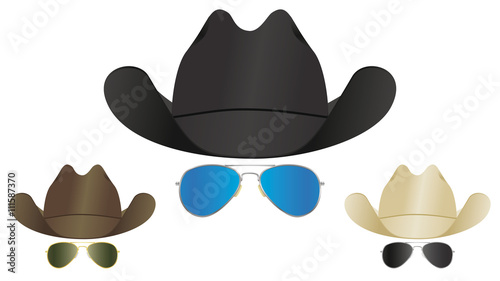 A selection of country and western cowboy hats and aviator sunglasses.
