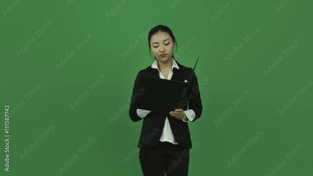 Asian business woman isolated greenscreen green background happy ring binder