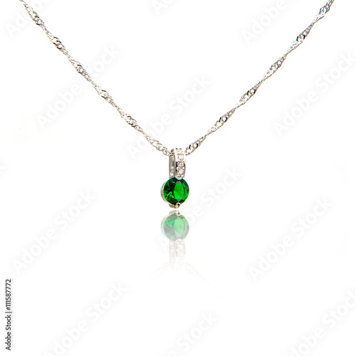 Emerald pendant isolated on white 