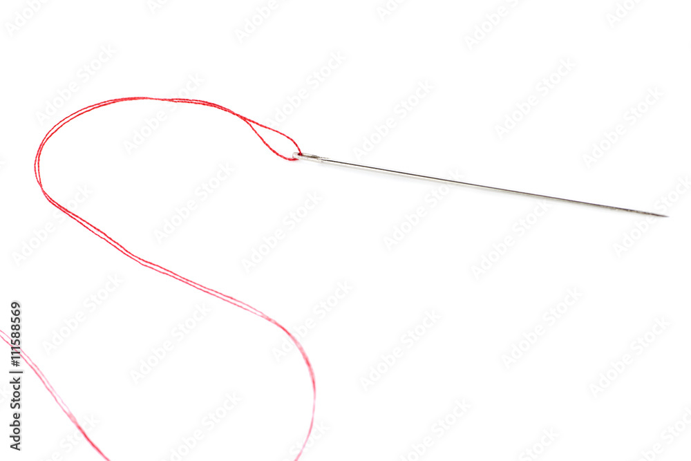 Obraz premium Small needle with thread isolated over the white background