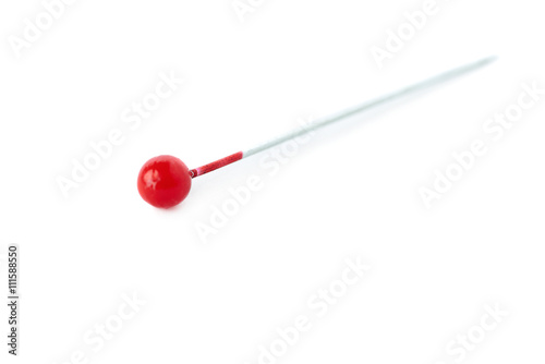 Small needle isolated over the white background