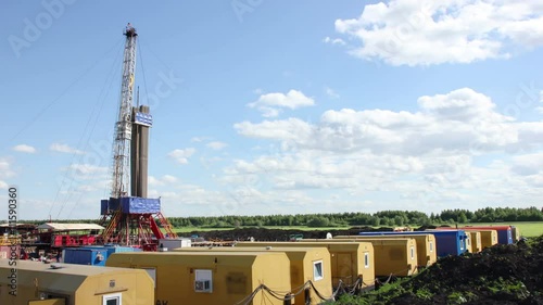 Clouds over oil gas drilling rig