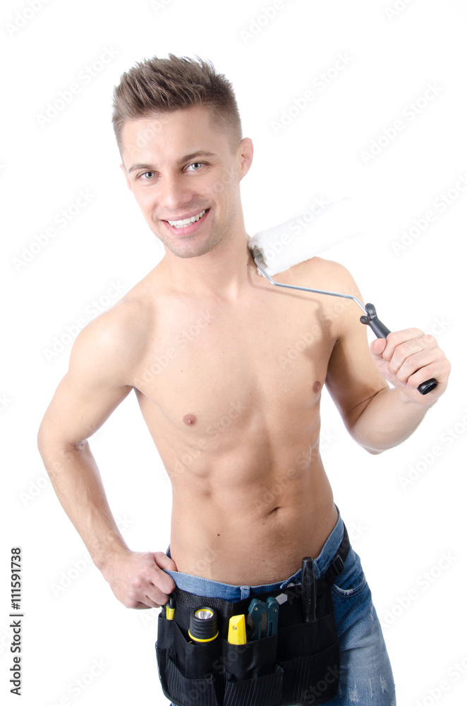Young handyman with a roller. Young handyman with a roller.