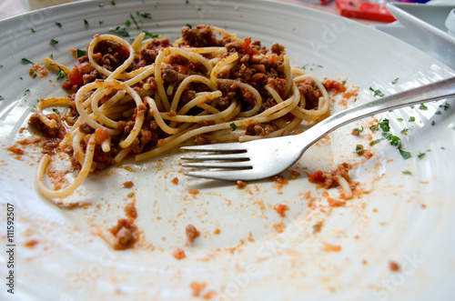 Unfinished meal of spaghetti bolognaise