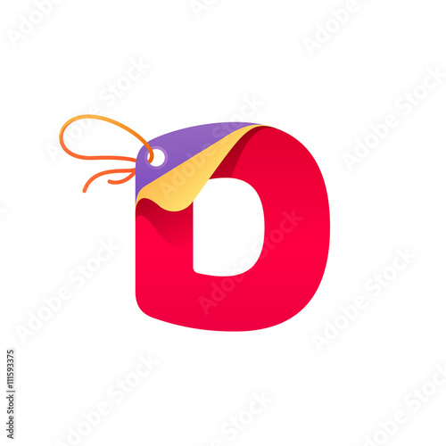 D letter with paper folded corner and sale tag.