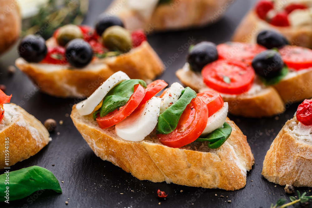 Bruschetta with tomatoes, mozzarella and basil Bruschetta with tomatoes, mozzarella and basil