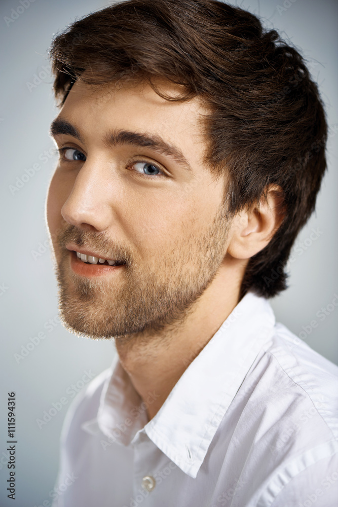Fototapeta premium Portrait of young confident smiling businessman looking at camera.