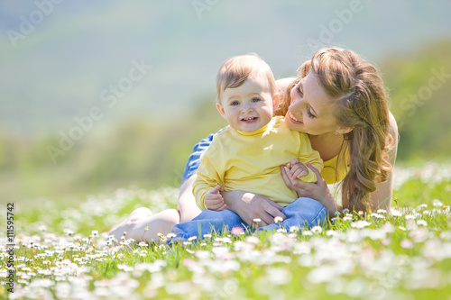 Mother with little son in a flower field  © nuzza11