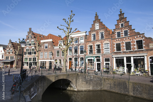 Canal and historic houses in the Netherlands photo