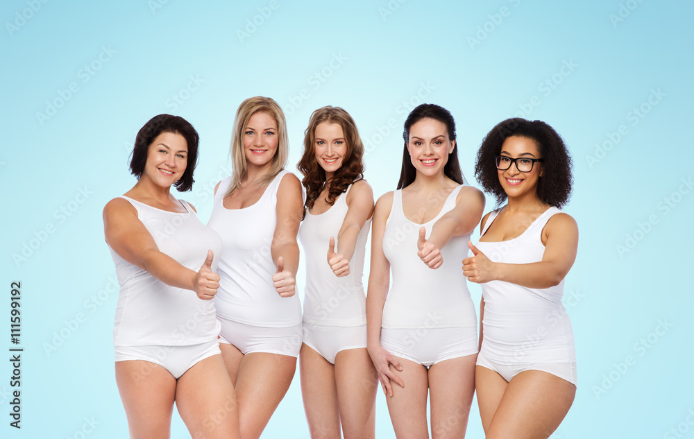 group of happy different women showing thumbs up group of happy different women showing thumbs up