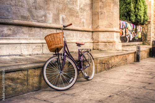 Iconic vintage bicycle at an old street of Cambridge