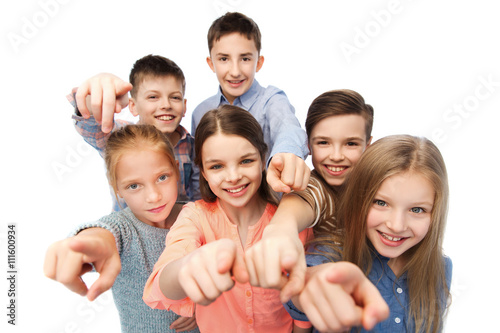 happy children pointing finger to you