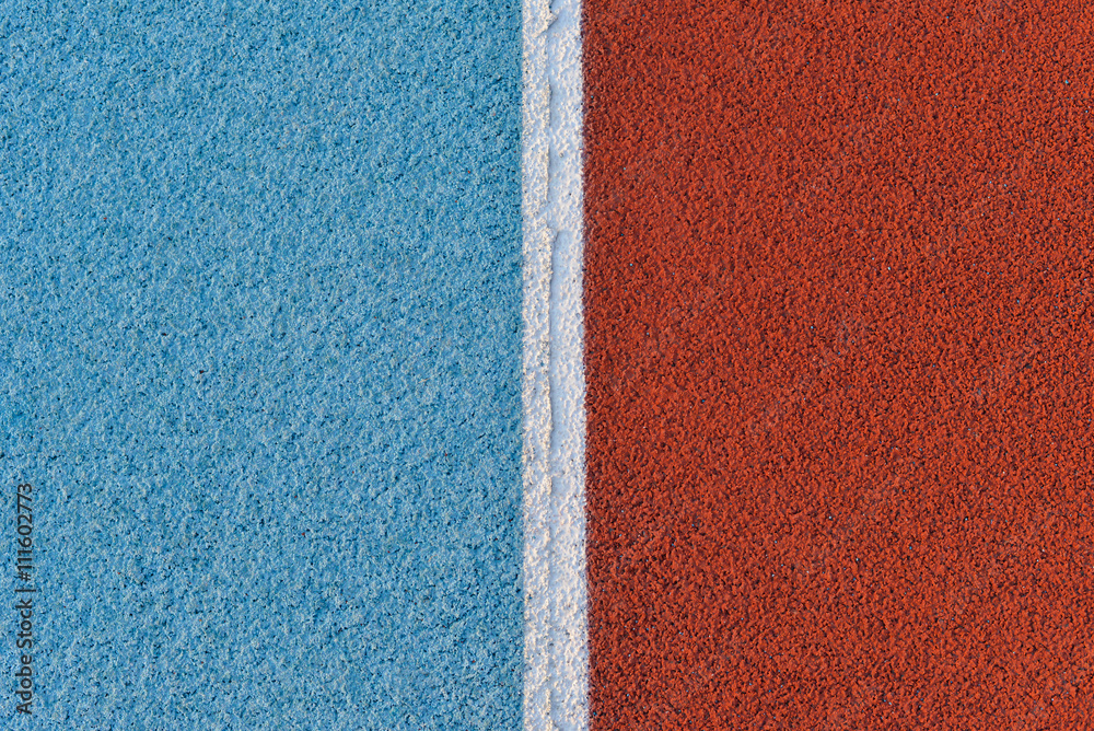 Fototapeta premium Blue and red running track rubber cover with white line