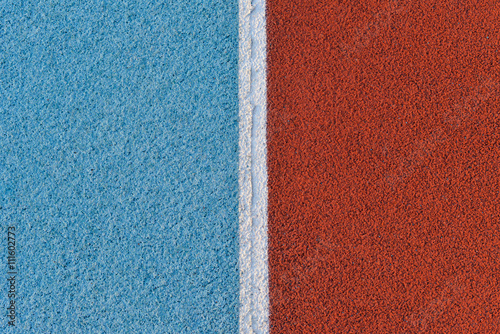 Blue and red running track rubber cover with white line