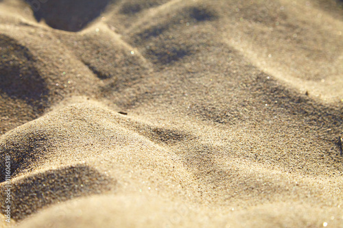 Small sand dunes on beach.