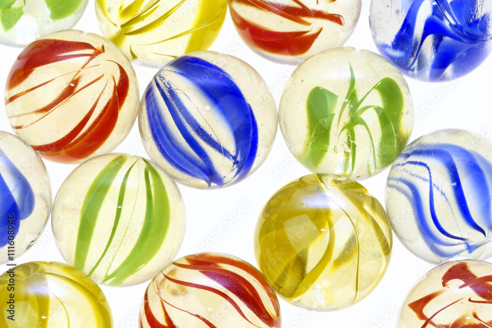 Colorful glass marbles on white background