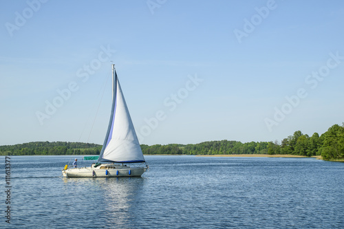 Small sailing boat with a captain