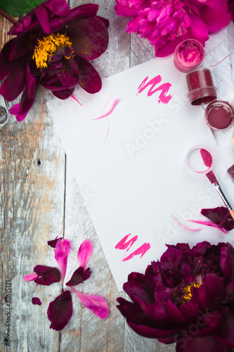 Workspace. Watercolor  paintbrush and pink peonies isolated on white background. Overhead view. Flat lay  top view