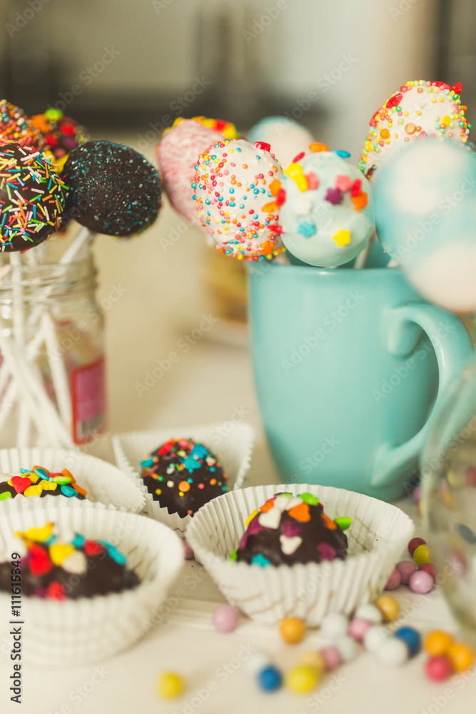 Fototapeta premium Image with warm filter of candies and pop cake at confectionery