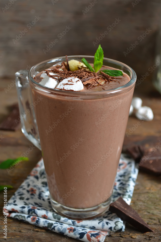 chocolate smoothie with oats and marshmallow on a wooden backgro chocolate smoothie with oats and marshmallow on a wooden backgro