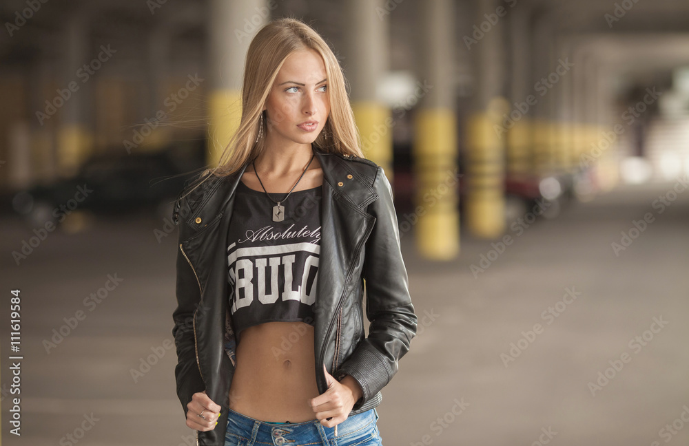 Fototapeta premium beautiful young blond woman walking outdoors in summer