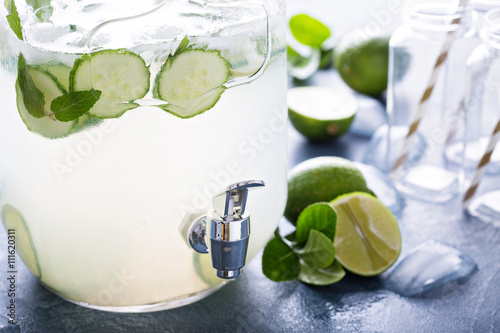 Lime and cucumber lemonade in dispencer photo