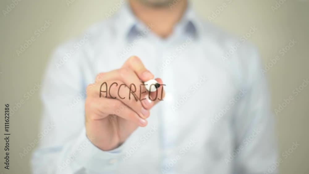 Accredited, man writing on transparent screen Accredited, man writing on transparent screen