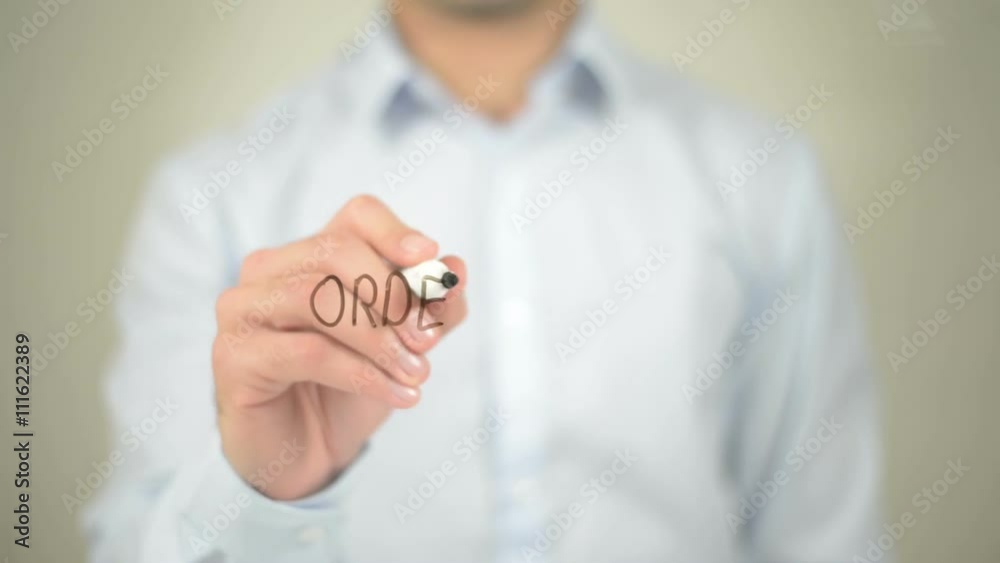 Order Now, man writing on transparent screen Order Now, man writing on transparent screen