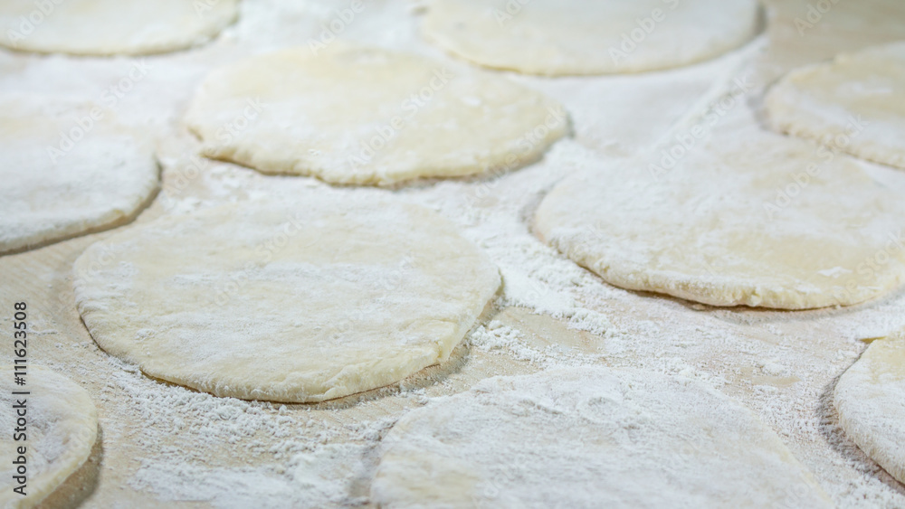 round shape of the dough with flour on the table round shape of the dough with flour on the table