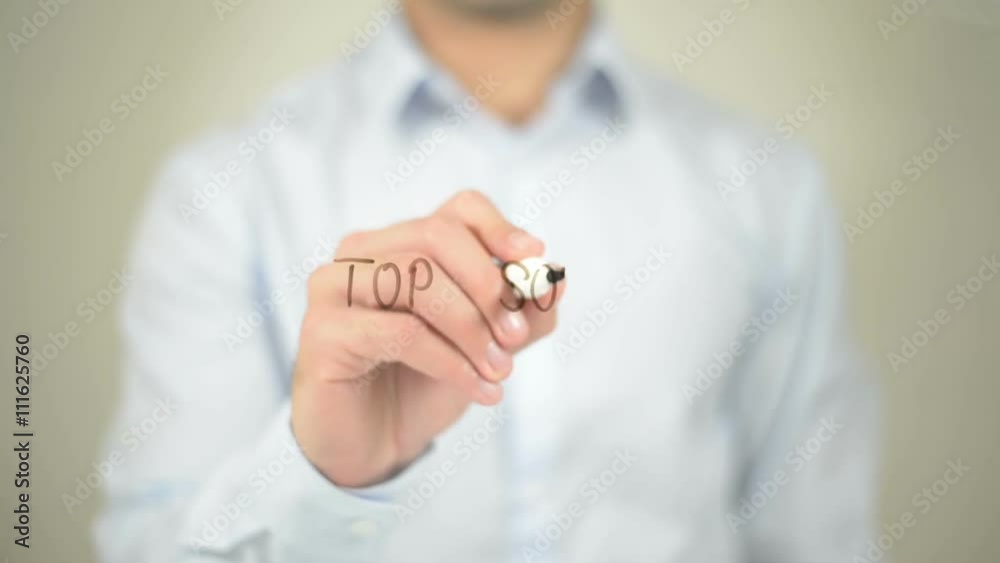 Top Songs , man writing on transparent screen Top Songs , man writing on transparent screen