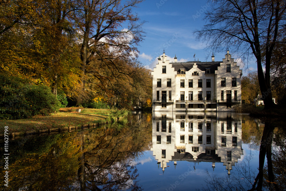Castle Staverden reflecting in the moat and surrounded by autumn colored trees
Castle Staverden reflecting in the moat and surrounded by autumn colored trees